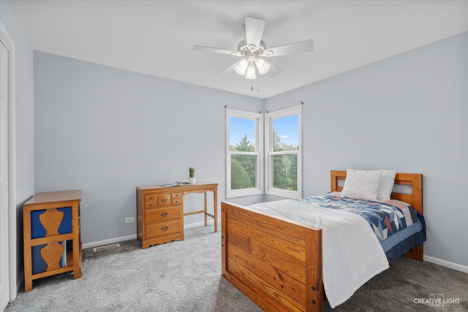 3812 Grassmere Road Naperville, IL 60564 - Photo 23 of 46 a bed room with a bed and a chandelier