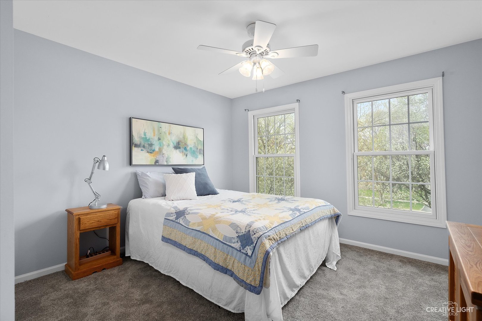 3812 Grassmere Road Naperville, IL 60564 - Photo 24 of 46 a bedroom with a bed a chandelier and a window