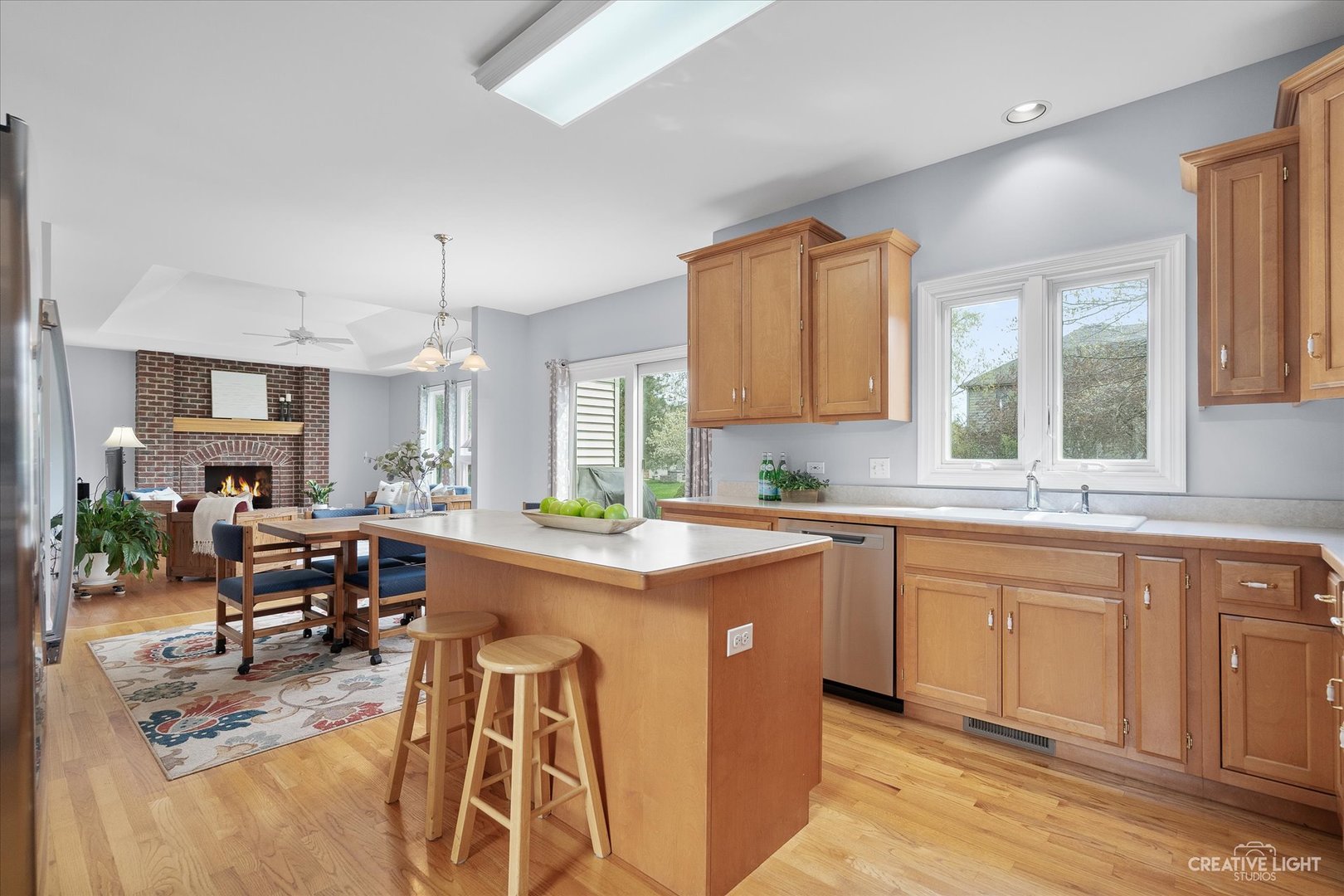 3812 Grassmere Road Naperville, IL 60564 - Photo 8 of 46 a kitchen with a stove a sink a dining table and chairs
