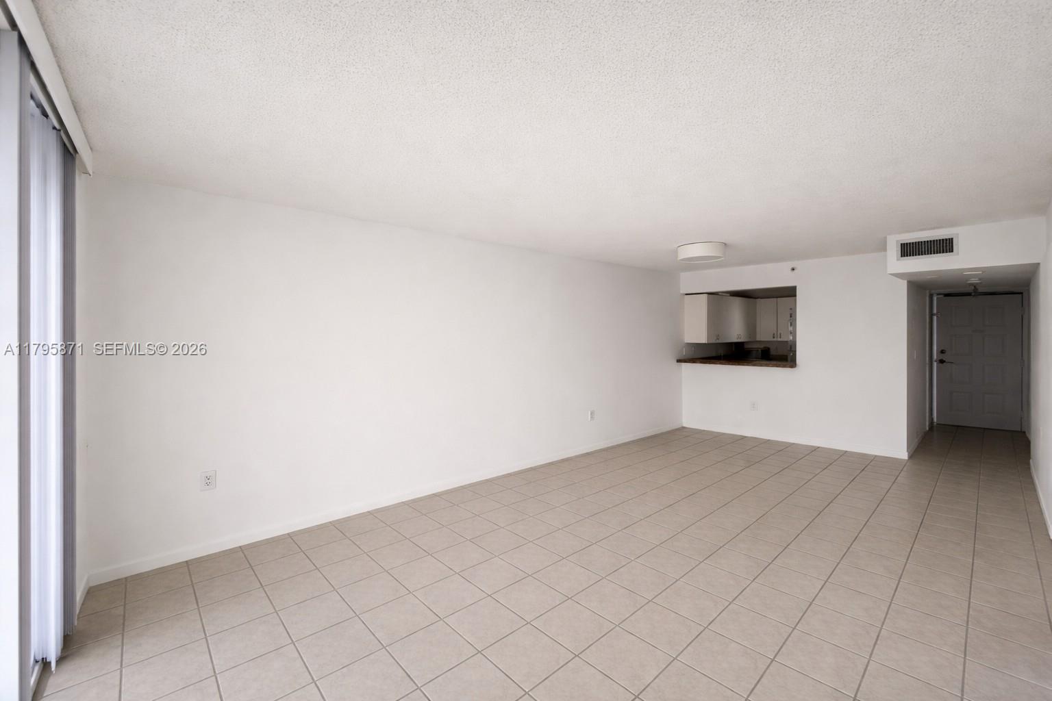 126 Southwest 17th Road, Unit 505 Miami, FL 33129 - Photo 7 of 27 an empty room with entrance and mirror