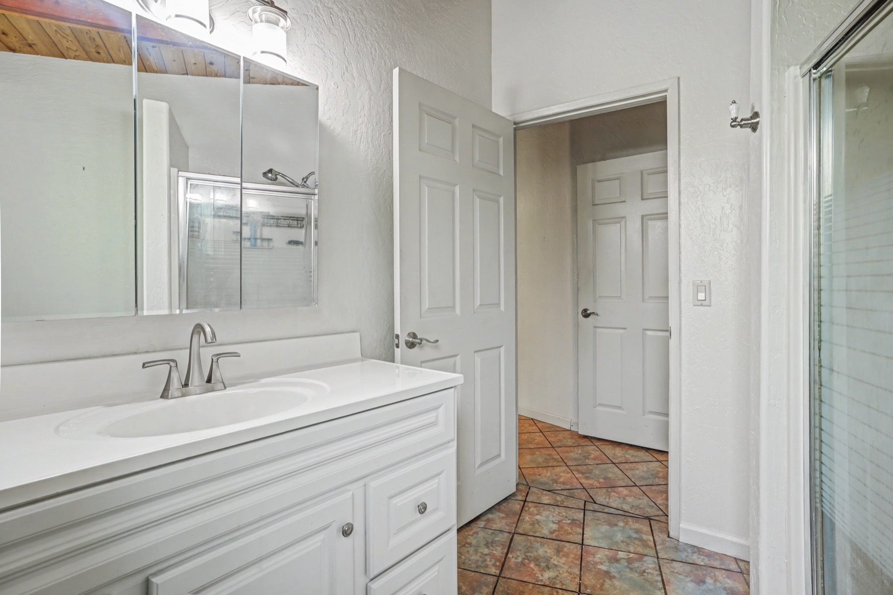 5715 Kaehulua Road, Unit 1 Kapaa, HI 96746 - Photo 17 of 23 a bathroom with a sink a toilet and shower