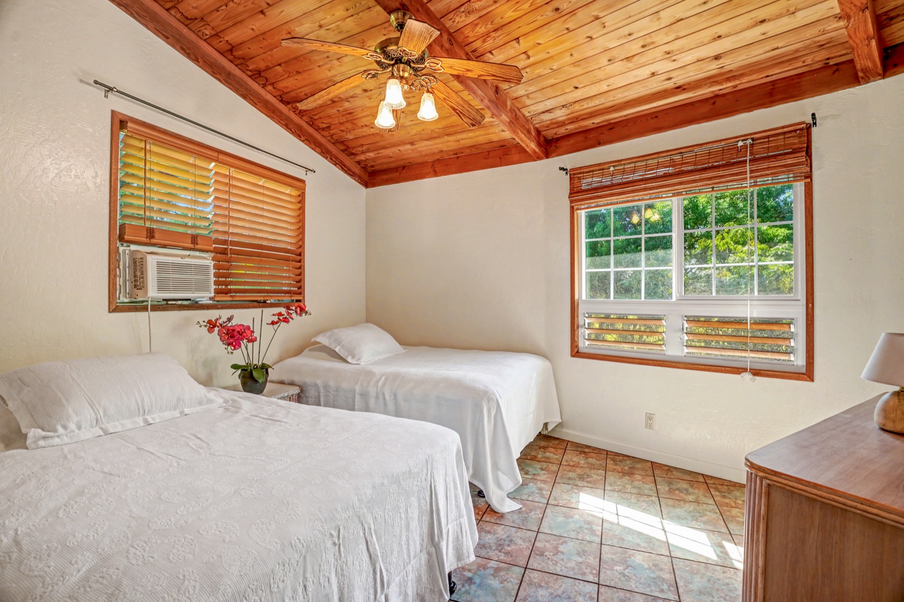 5715 Kaehulua Road, Unit 1 Kapaa, HI 96746 - Photo 18 of 23 a bedroom with a bed and a window