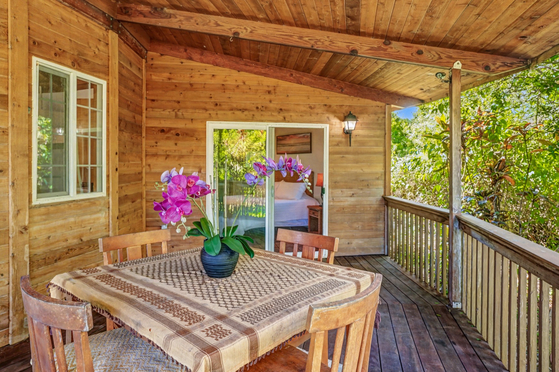 5715 Kaehulua Road, Unit 1 Kapaa, HI 96746 - Photo 8 of 23 a view of an outdoor dining space with furniture