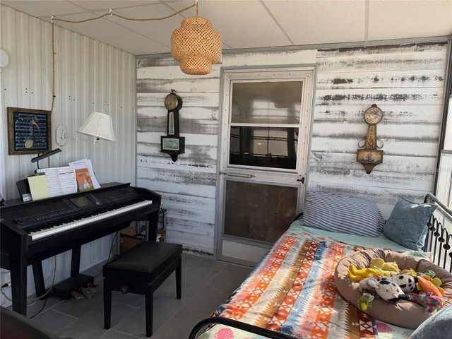 a bedroom with a bed and a table