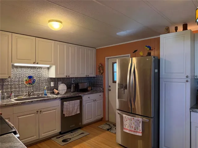 a view of a house with backyard porch and sitting area