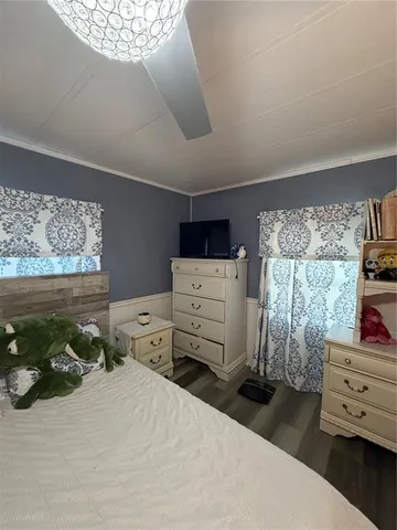 a bedroom with a bed and lamp