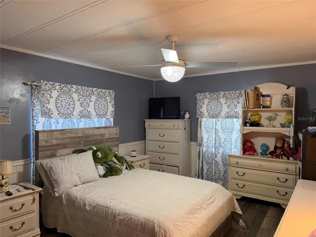 a front view of a house with garden and lake view