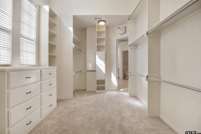 a view of empty room with windows and entryway