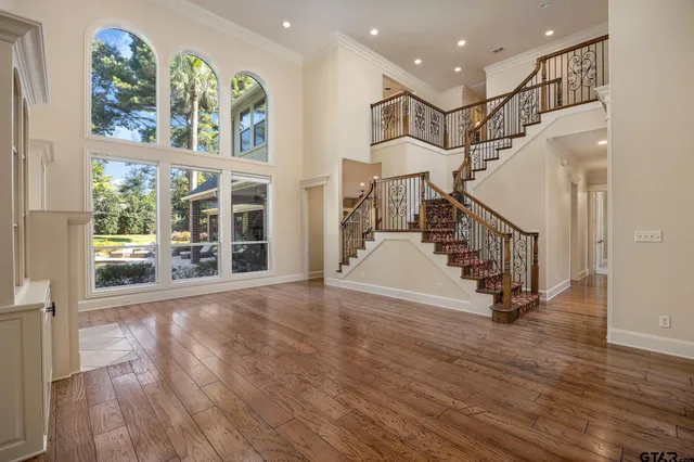 a view of entryway with wooden floor and windows