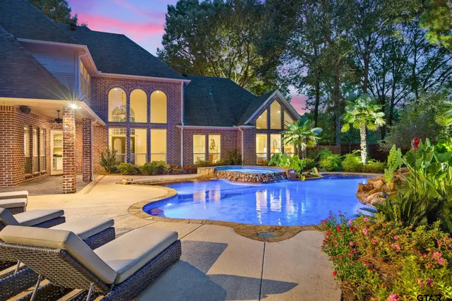 a view of swimming pool with outdoor seating
