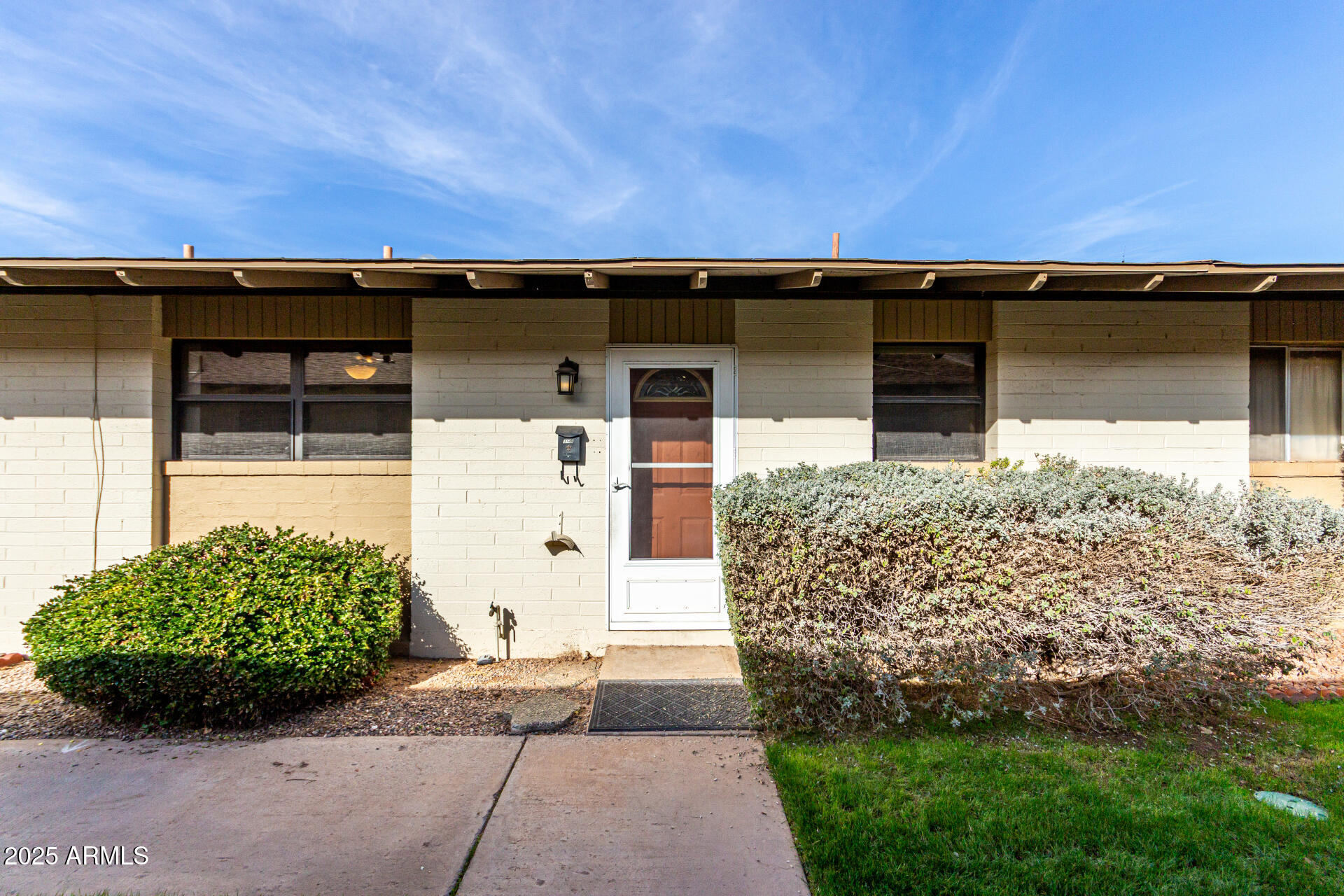 6721 East McDowell Road, Unit B314 Scottsdale, AZ 85257 - Photo 1 of 31 a view of a house with a large window and garage