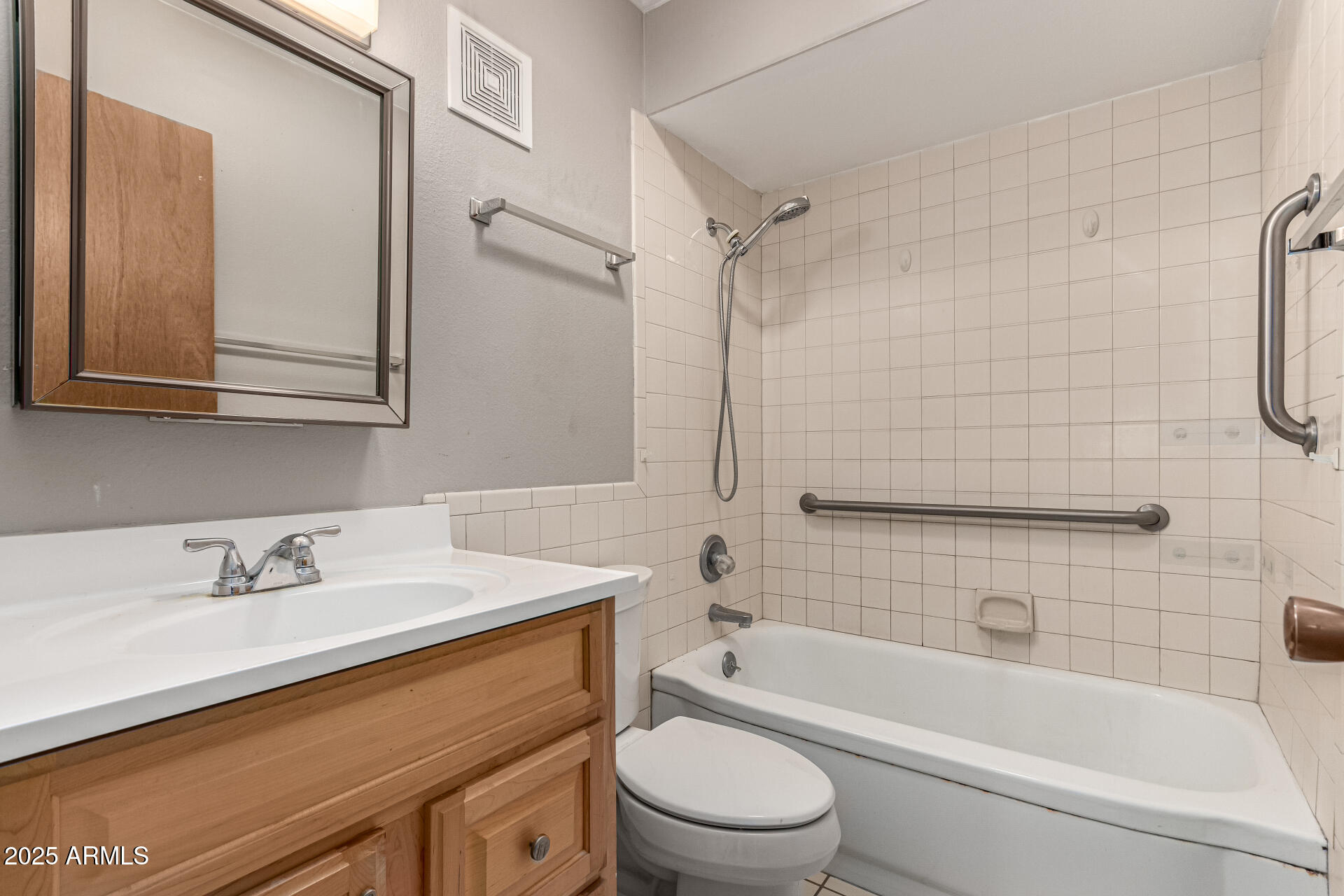 6721 East McDowell Road, Unit B314 Scottsdale, AZ 85257 - Photo 22 of 31 a bathroom with a sink a toilet and shower