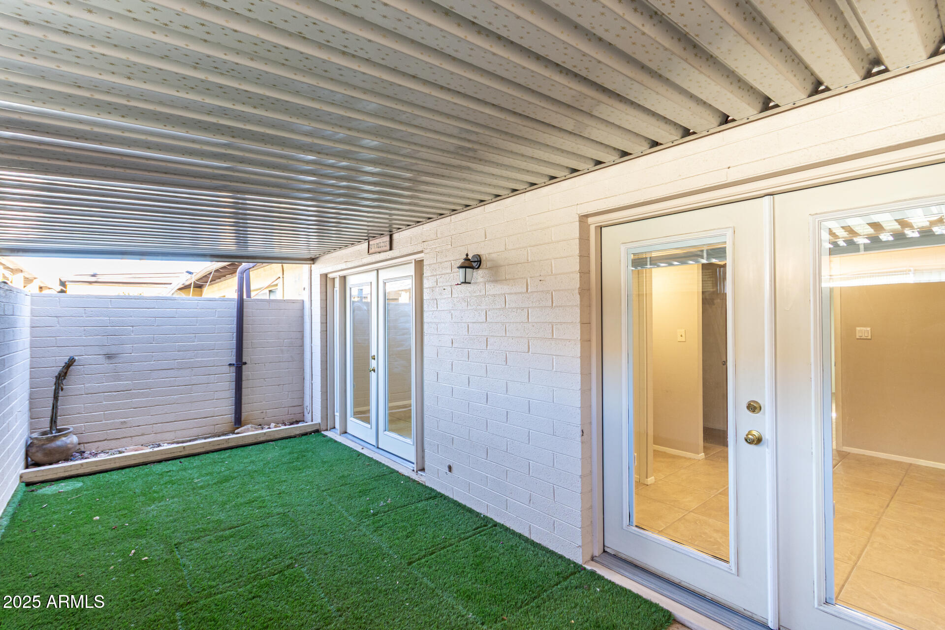 6721 East McDowell Road, Unit B314 Scottsdale, AZ 85257 - Photo 24 of 31 a view of a backyard with wooden floor and a cabin