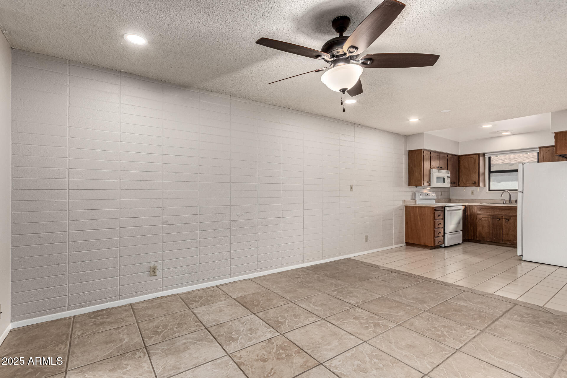 6721 East McDowell Road, Unit B314 Scottsdale, AZ 85257 - Photo 8 of 31 a view of a kitchen with a sink and a window