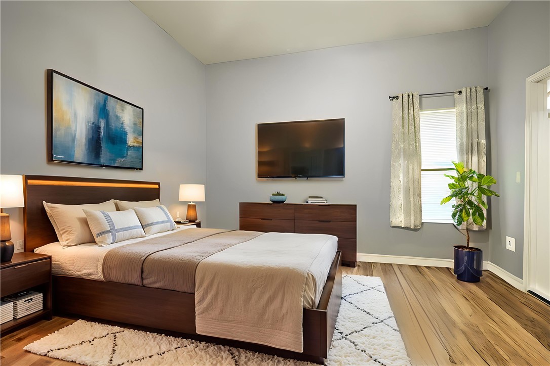 904 Crested Point Drive College Station, TX 77845 - Photo 7 of 11 Primary bedroom featuring wood finished floors