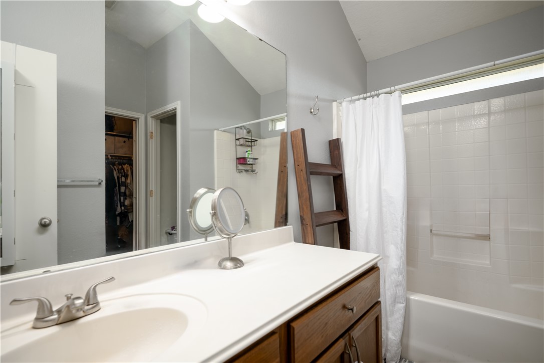 904 Crested Point Drive College Station, TX 77845 - Photo 9 of 11 Primary bathroom with shower / bath combination with vanity, and a walk in closet