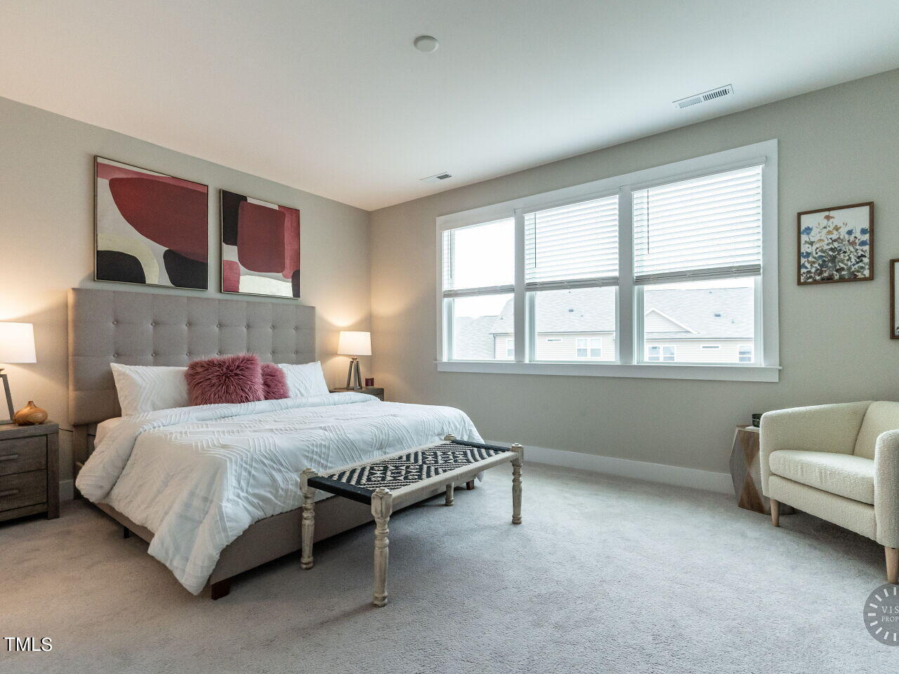 806 Malta Way Durham, NC 27703 - Photo 20 of 37 a bedroom with a bed couch and window