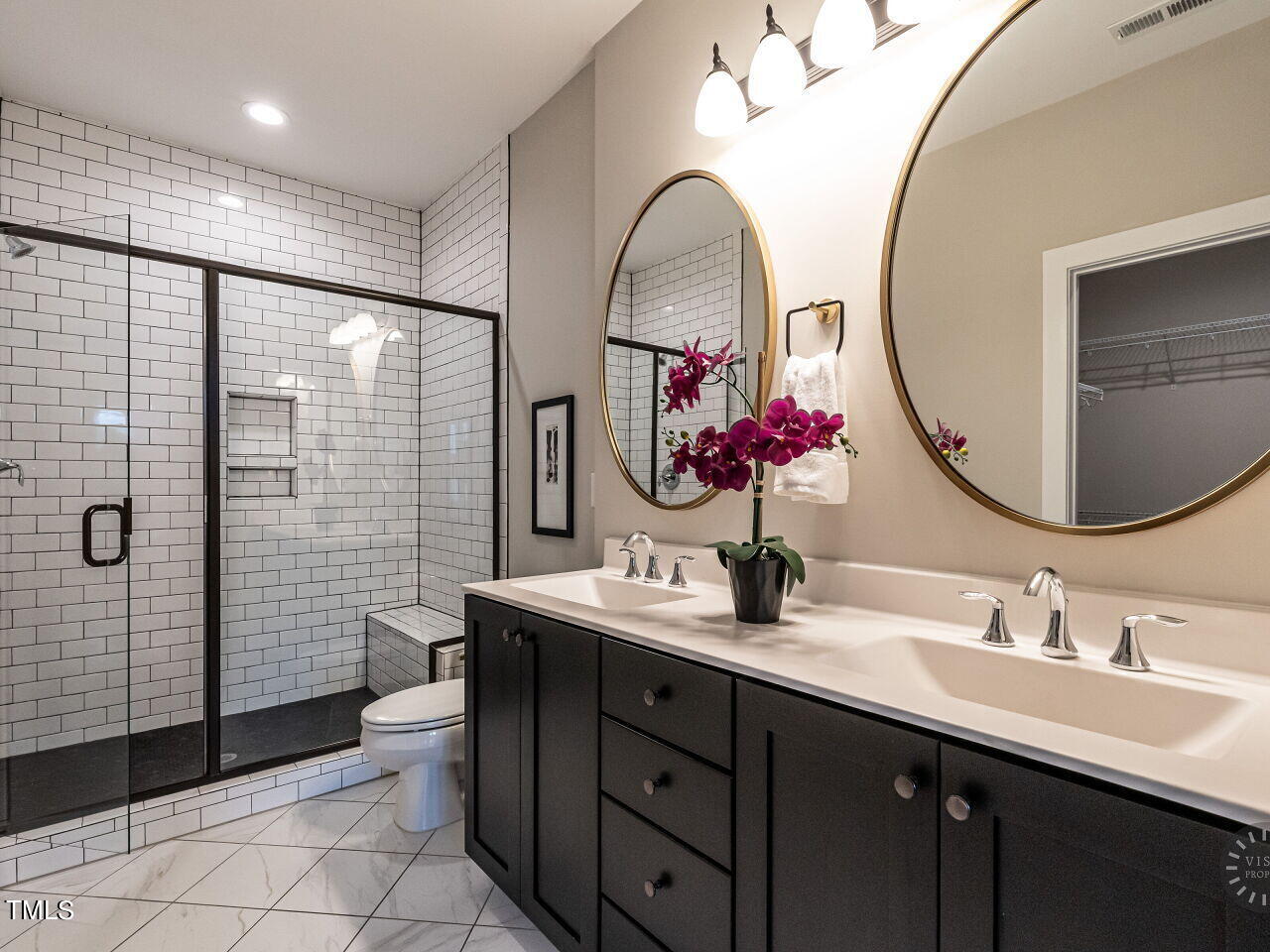 806 Malta Way Durham, NC 27703 - Photo 22 of 37 a bathroom with a double vanity sink mirror and toilet