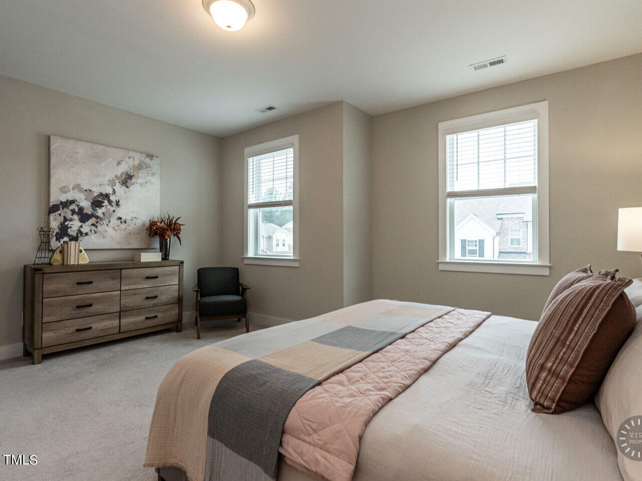 806 Malta Way Durham, NC 27703 - Photo 24 of 37 a bedroom with a bed and a window
