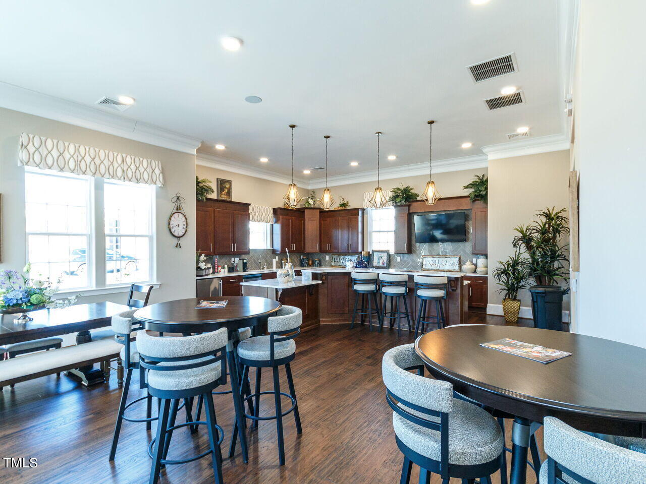 806 Malta Way Durham, NC 27703 - Photo 32 of 37 a dining room with kitchen island a table and chairs