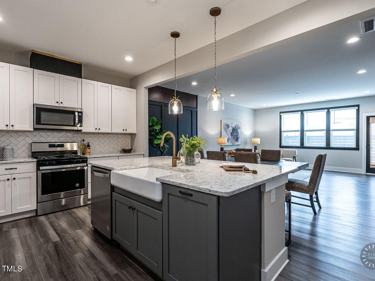 806 Malta Way Durham, NC 27703 - Photo 5 of 37 a kitchen with sink a microwave and chairs