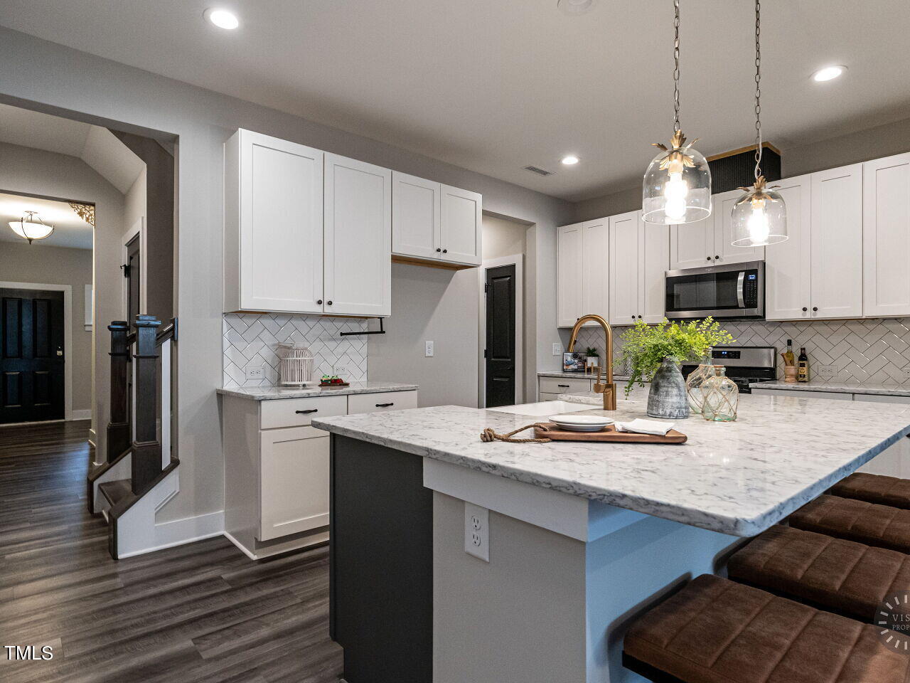 806 Malta Way Durham, NC 27703 - Photo 6 of 37 a kitchen with kitchen island granite countertop a sink cabinets and stainless steel appliances