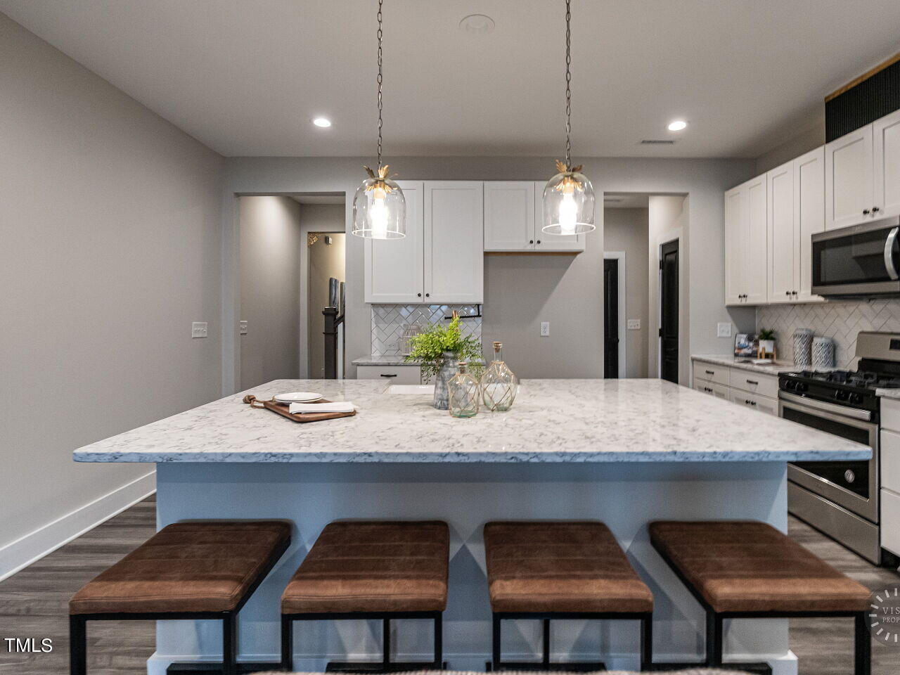 806 Malta Way Durham, NC 27703 - Photo 7 of 37 a kitchen with a table chairs and refrigerator