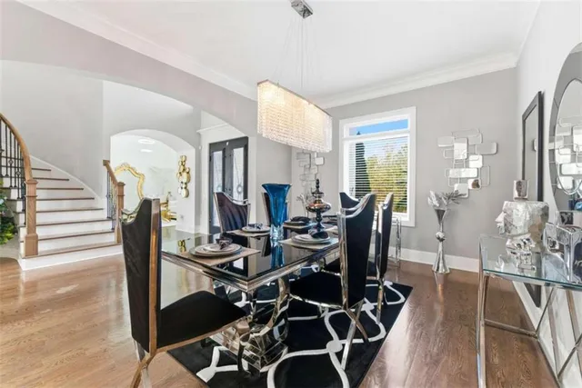 a bathroom with a granite countertop sink a toilet and a mirror
