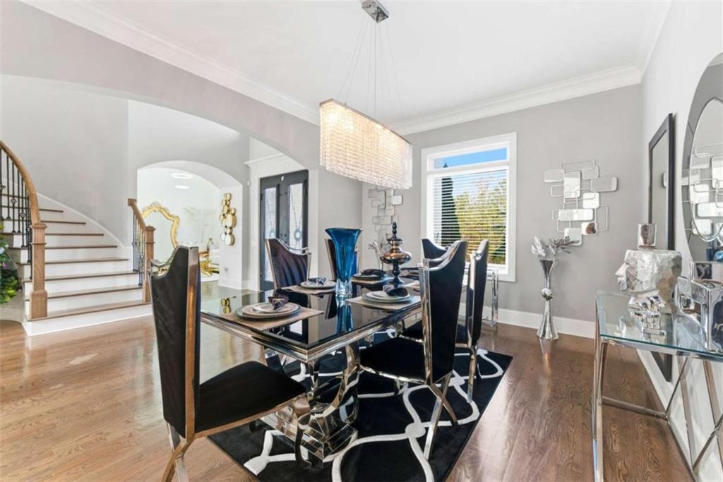 1616 Palmilla Way Southwest Stockbridge, GA 30281 - Photo 11 of 50 a view of a dining room with furniture and wooden floor