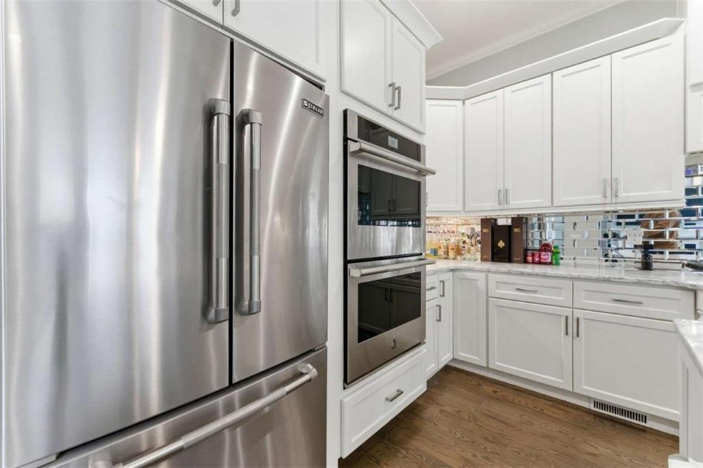 1616 Palmilla Way Southwest Stockbridge, GA 30281 - Photo 18 of 50 a kitchen with stainless steel appliances a refrigerator sink and cabinets