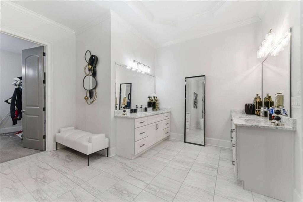 1616 Palmilla Way Southwest Stockbridge, GA 30281 - Photo 22 of 50 a bathroom with a sink and a mirror