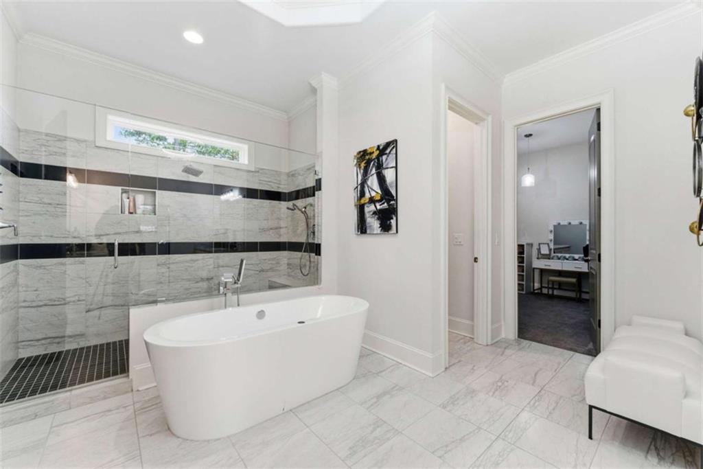 1616 Palmilla Way Southwest Stockbridge, GA 30281 - Photo 23 of 50 a bathroom with a bathtub and a sink