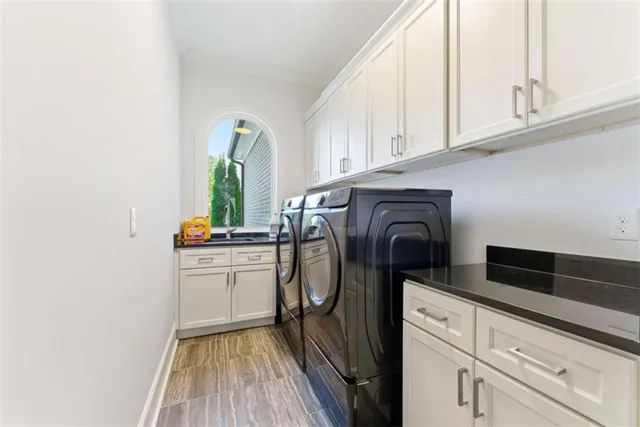 a view of a hallway with wooden floor and stairs