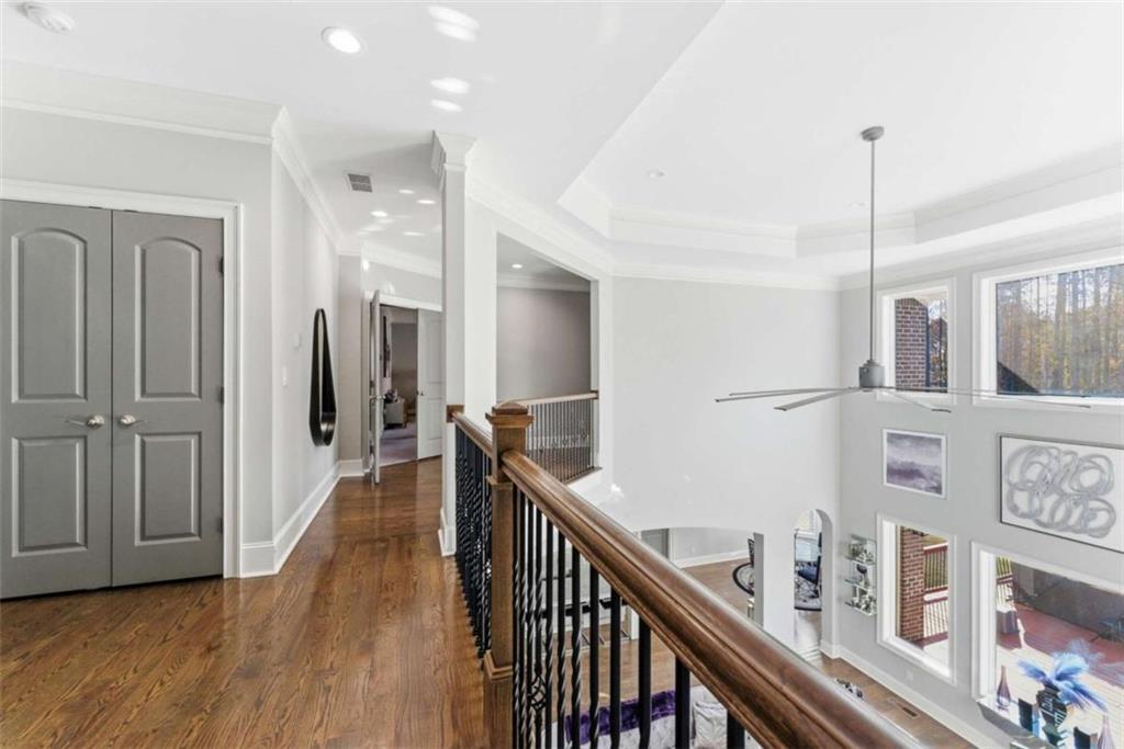 1616 Palmilla Way Southwest Stockbridge, GA 30281 - Photo 26 of 50 a view of a hallway with wooden floor and stairs
