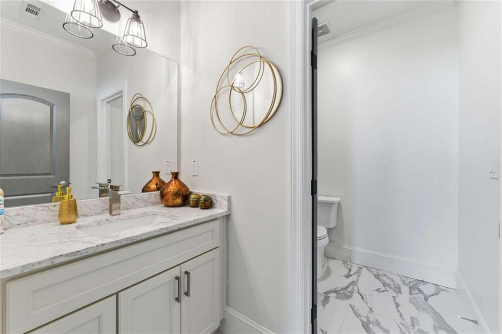 1616 Palmilla Way Southwest Stockbridge, GA 30281 - Photo 28 of 50 a bathroom with a sink and a mirror