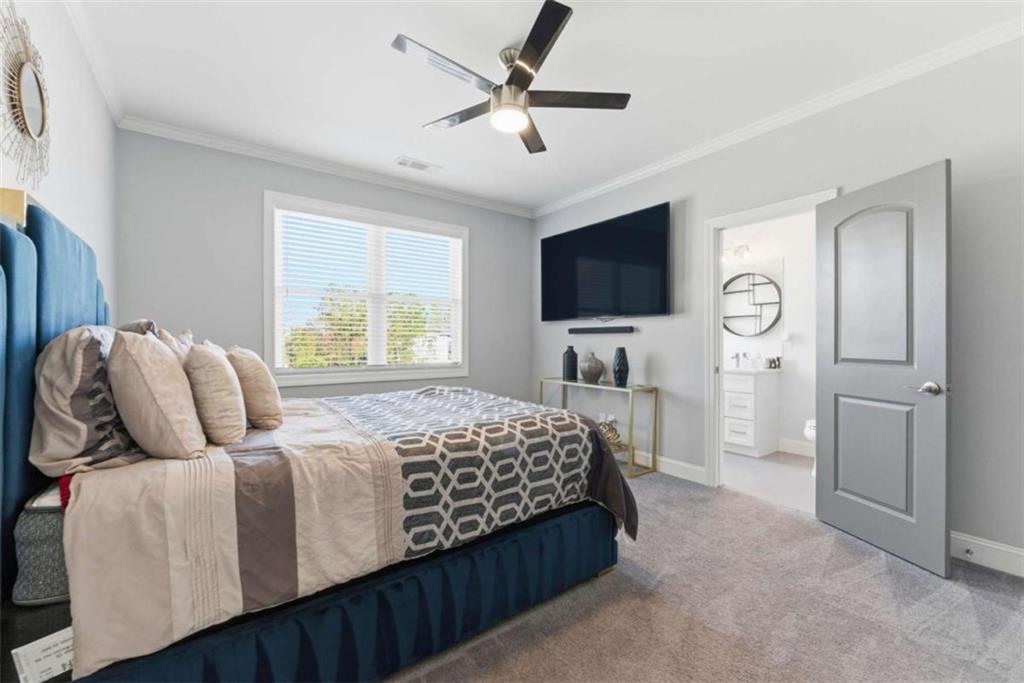 1616 Palmilla Way Southwest Stockbridge, GA 30281 - Photo 29 of 50 a bedroom with bed tv and window