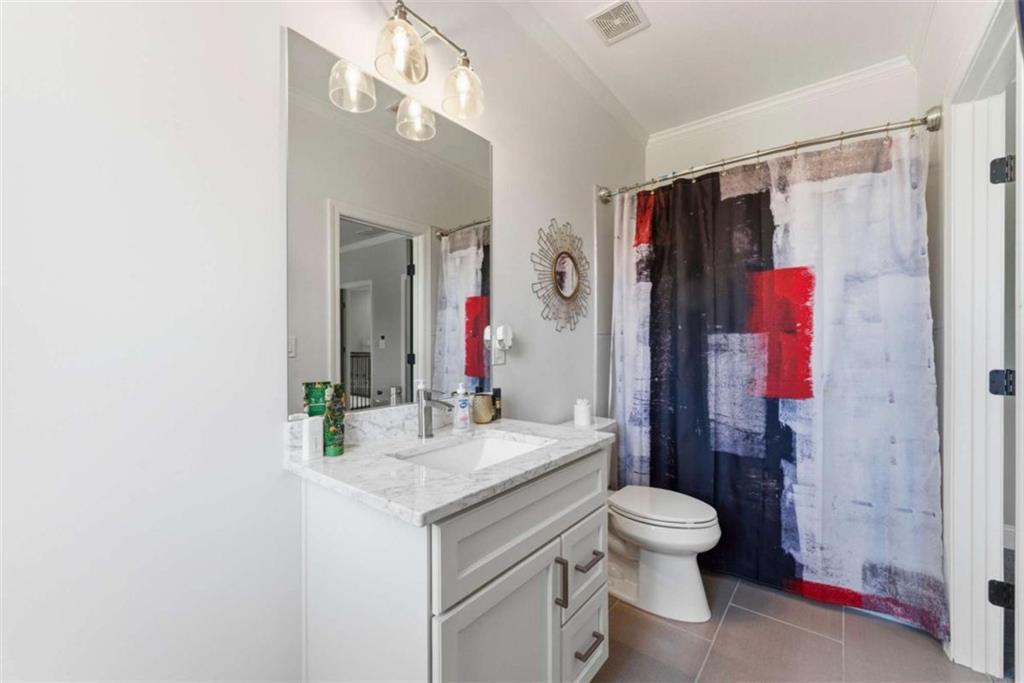 1616 Palmilla Way Southwest Stockbridge, GA 30281 - Photo 30 of 50 a bathroom with a granite countertop sink toilet and shower
