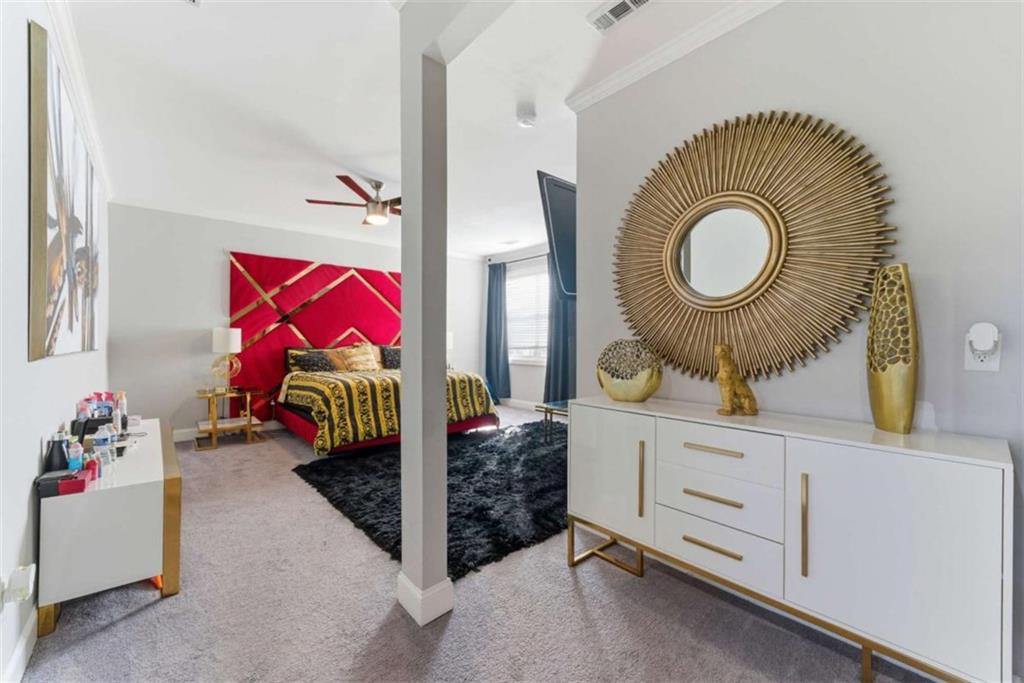 1616 Palmilla Way Southwest Stockbridge, GA 30281 - Photo 32 of 50 a bedroom with a bed and a dresser