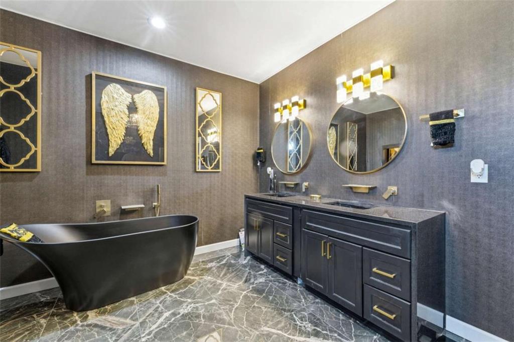 1616 Palmilla Way Southwest Stockbridge, GA 30281 - Photo 37 of 50 a bathroom with a double vanity sink and a mirror