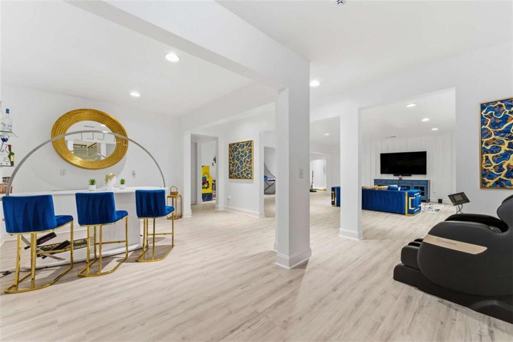 1616 Palmilla Way Southwest Stockbridge, GA 30281 - Photo 39 of 50 a living room with furniture and a flat screen tv