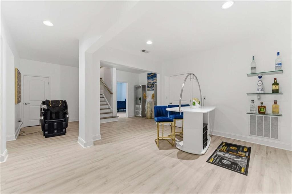 1616 Palmilla Way Southwest Stockbridge, GA 30281 - Photo 40 of 50 a view of a workspace with furniture and wooden floor
