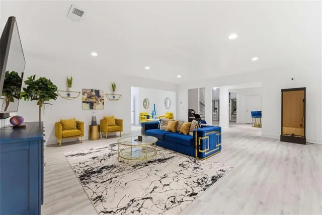 a living room with furniture and white walls