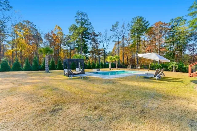 a front view of a house with swimming pool