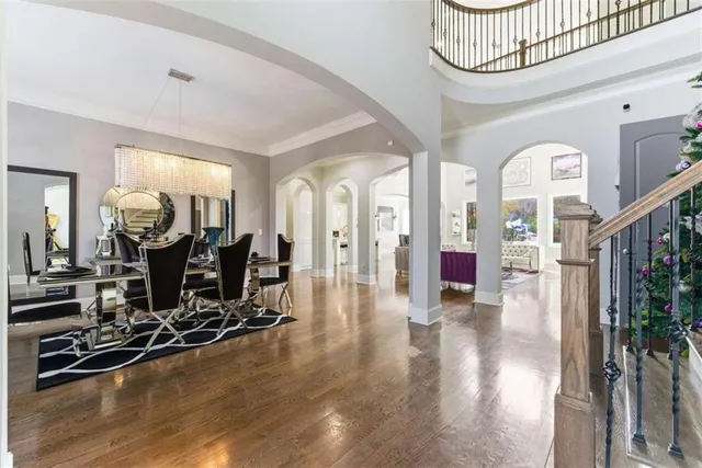 a view of entryway and hall with wooden floor
