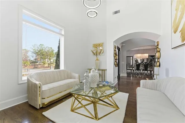 a view of a dining room with furniture and wooden floor
