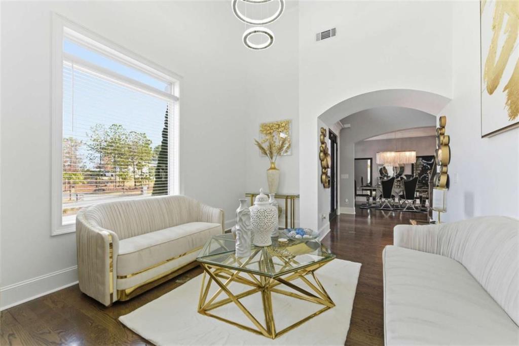 1616 Palmilla Way Southwest Stockbridge, GA 30281 - Photo 9 of 50 a living room with furniture and a large window