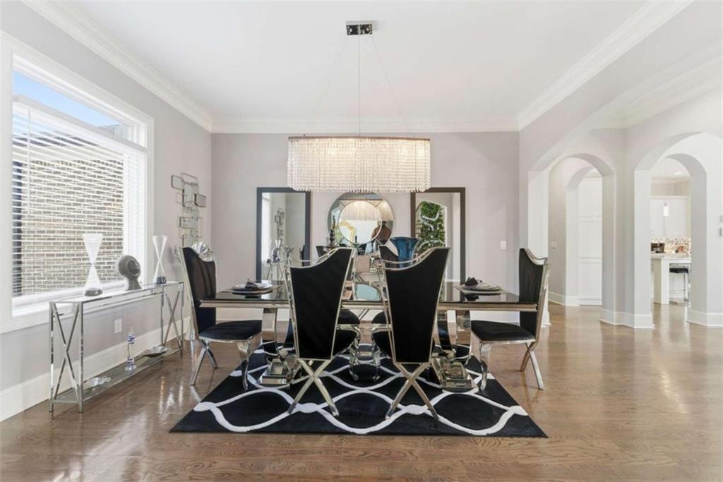 1616 Palmilla Way Southwest Stockbridge, GA 30281 - Photo 10 of 50 a view of a dining room with furniture and wooden floor