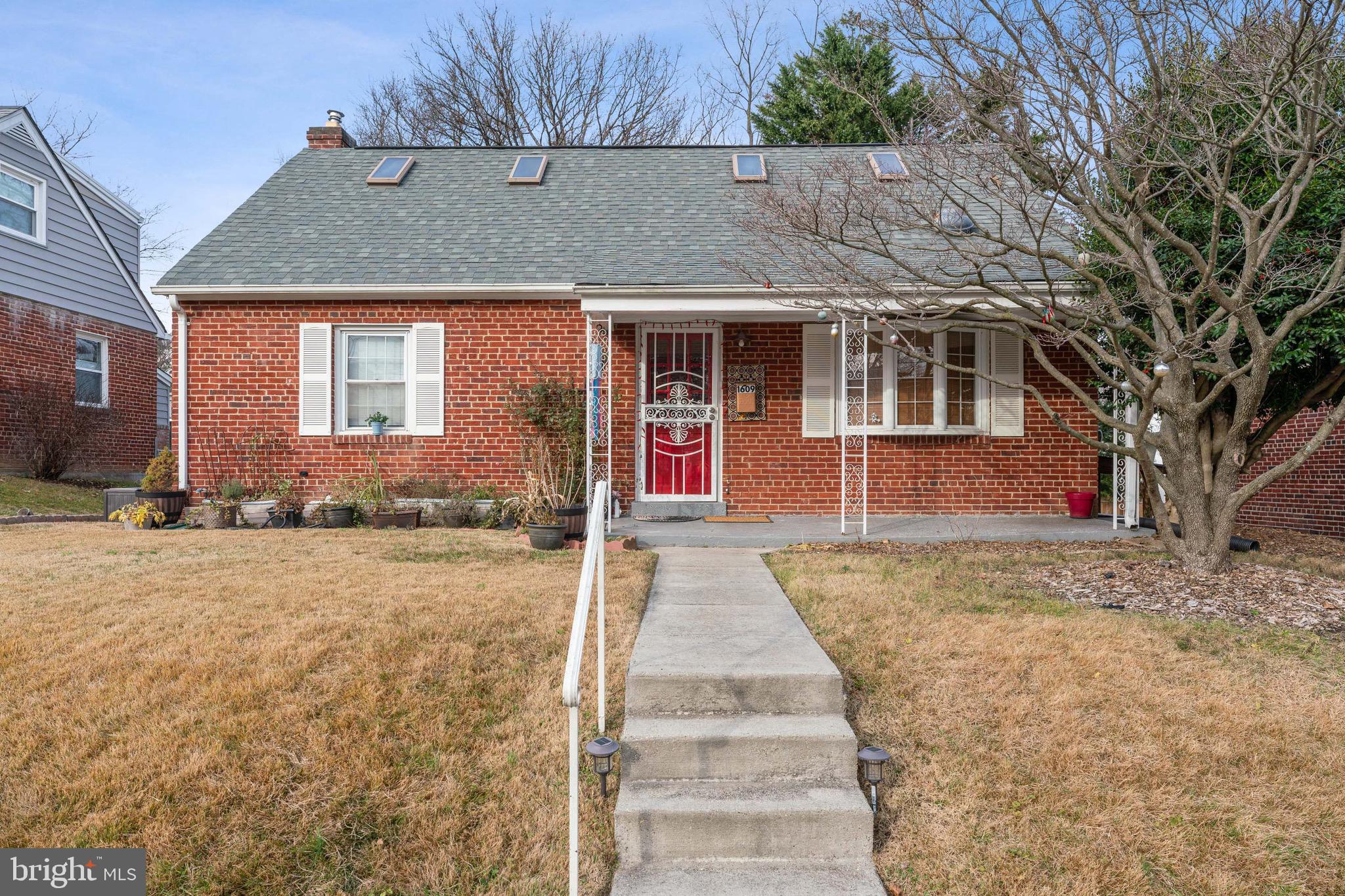 1609 Brisbane Street Silver Spring, MD 20902 - Photo 1 of 25 a front view of a house with a yard