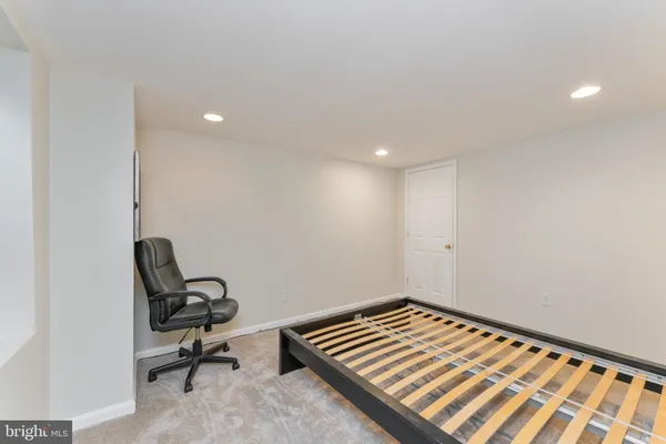 a view of a room with workspace and a window