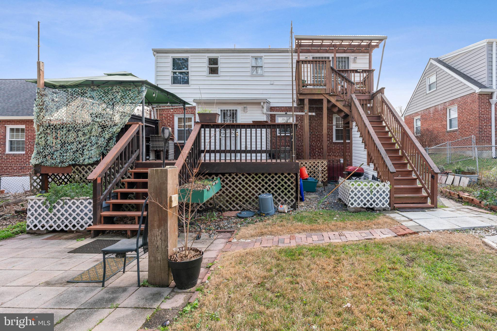 1609 Brisbane Street Silver Spring, MD 20902 - Photo 17 of 25 a view of a deck with two chairs and a table